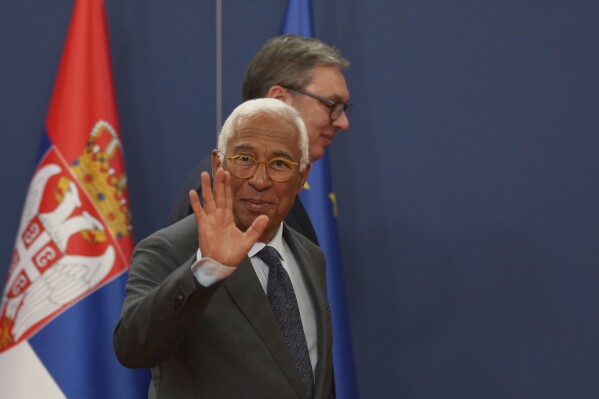 European Council President Antonio Costa waves and leaves with Serbian President Aleksandar Vucic after a press conference at the Serbia Palace in Belgrade, Serbia, Tuesday, May 13, 2025. (AP Photo/Darko Vojinovic)